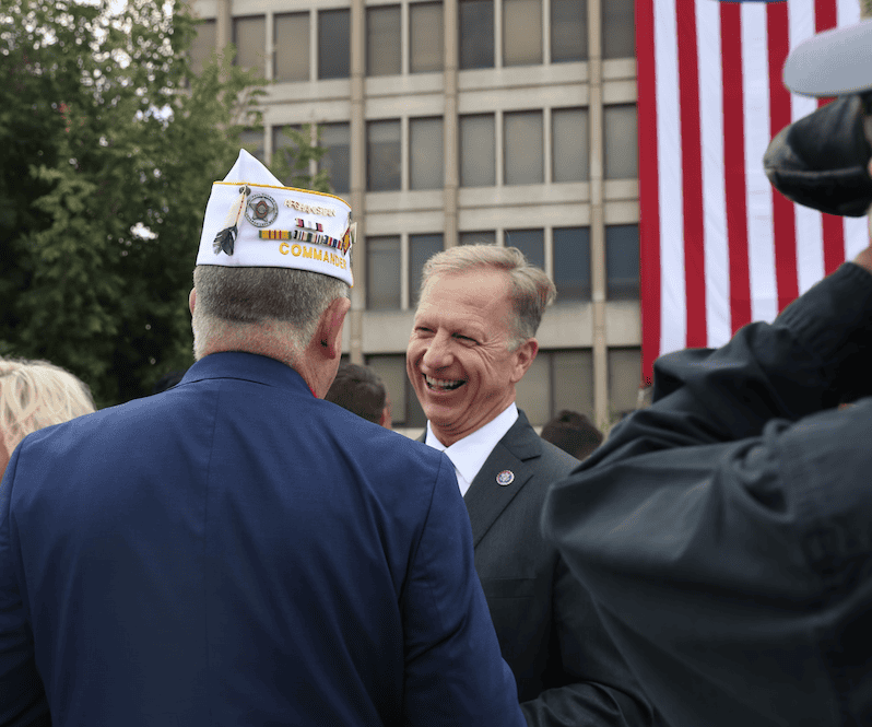 Kevin Hern engaging at a patriotic event, showcasing his commitment to American values and strong leadership.
