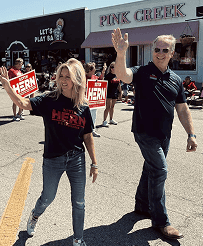 Kevin Hern waving at a campaign event in front of Pink Creek.